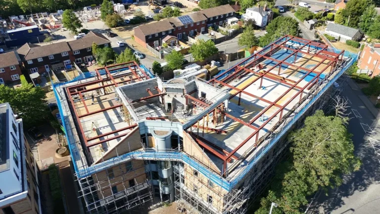 Commercial structural steel contractors installing a bespoke structural steel frame for a multi-storey building in London.