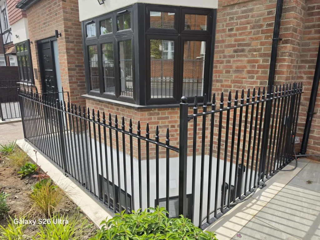 Custom black steel perimeter railings fabricated and installed by Franks Steel for a residential property.